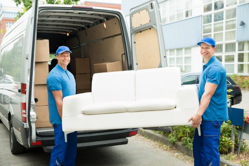Man and van moving boxes in Twickenham residential street