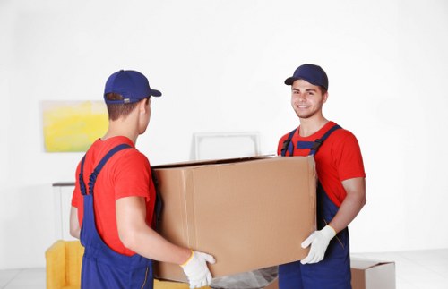 Packed boxes and wrapped furniture prepared for a Twickenham home relocation