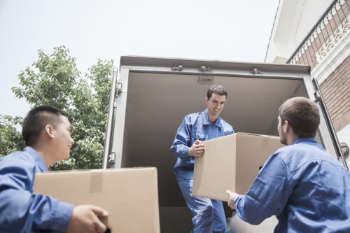 Driver and mover following safe working practices during unloading