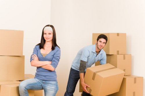 Worker assessing access and handling risks during a move