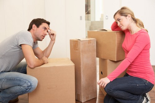 Specialist team handling piano removals in Twickenham inside a residential property