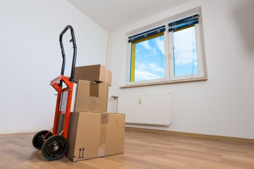 Unpacking boxes into a new Twickenham property with rooms organised by priority