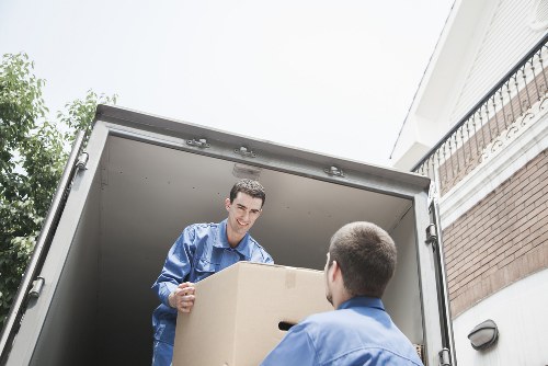 Local piano moving service navigating a narrow Twickenham staircase