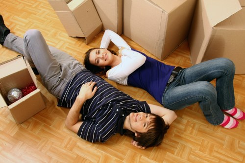A commercial relocation team organising furniture and office supplies for transport